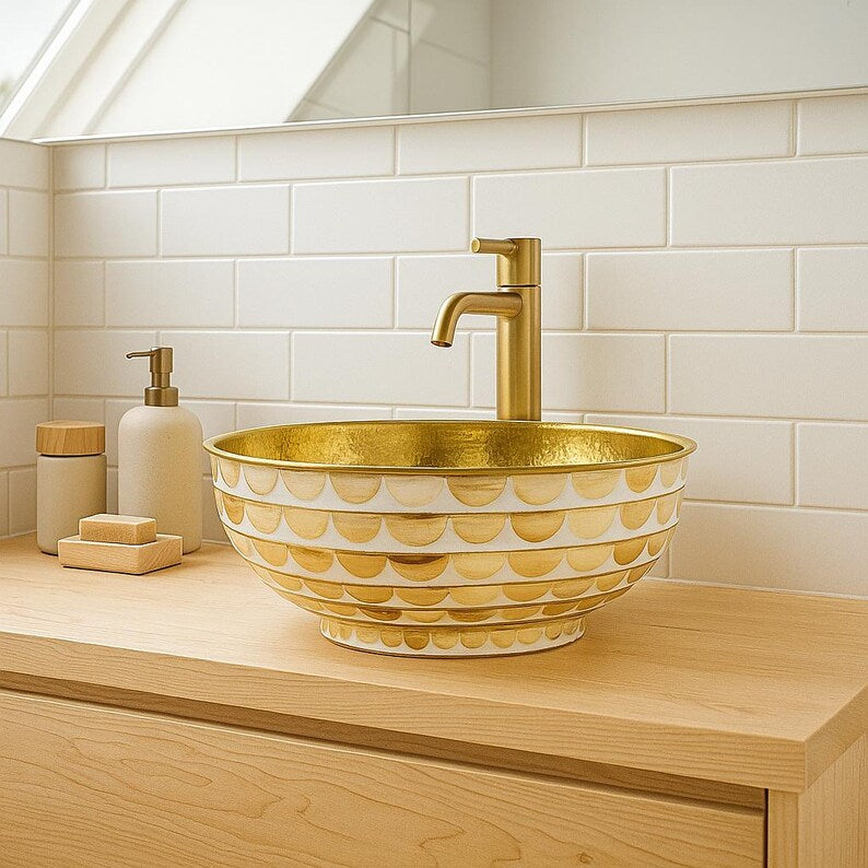 Handmade round brass vessel sink with hammered gold interior and ivory-toned wood inlays – countertop bathroom basin

