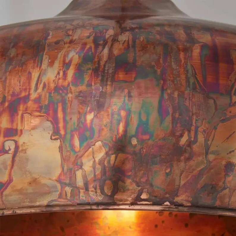 Iridescent copper dome ceiling light for rustic interiors

