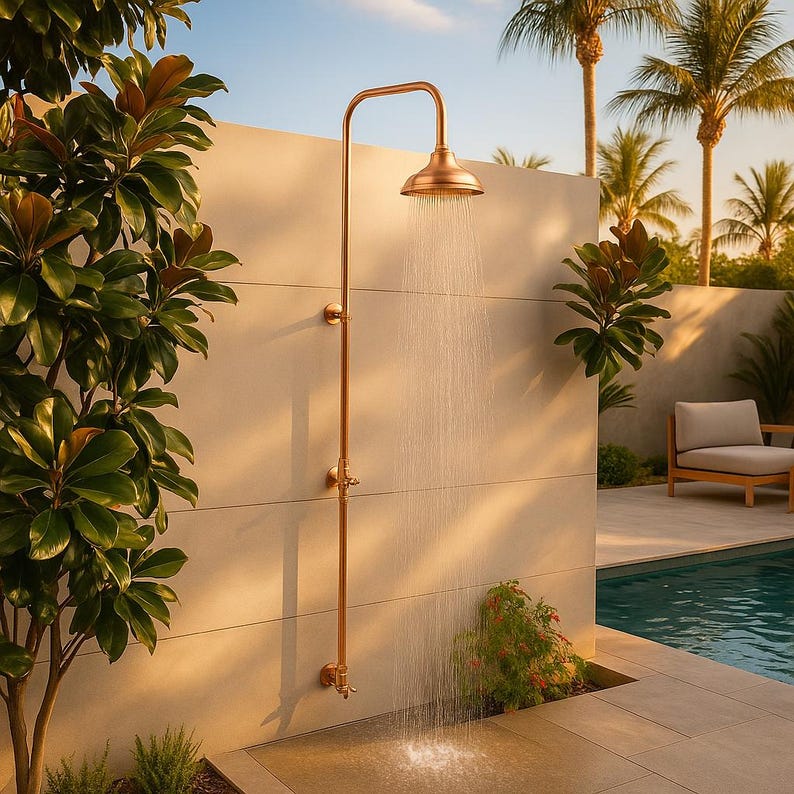 Minimalist copper and brass outdoor shower with natural patina finish

