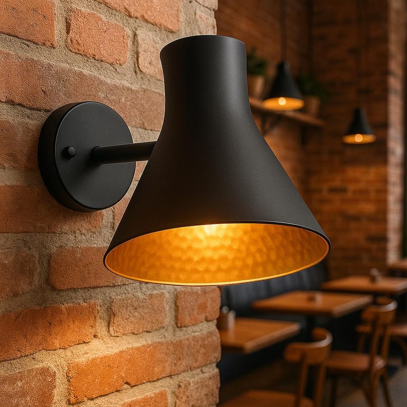 Modern black and brass wall light with Moroccan artisan design – ideal for villa or patio

