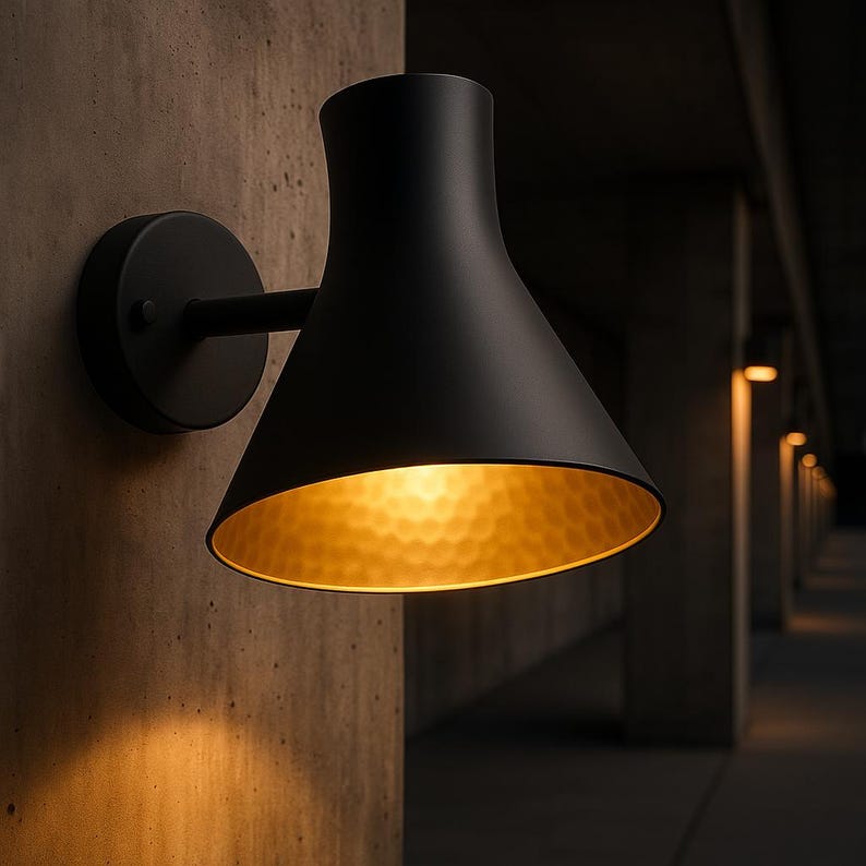 Modern black and brass wall light with Moroccan artisan design – ideal for villa or patio

