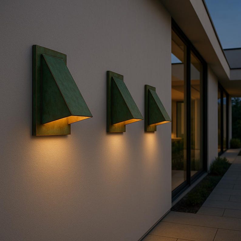 Moroccan brass wall lighting fixture with green patina and angular design