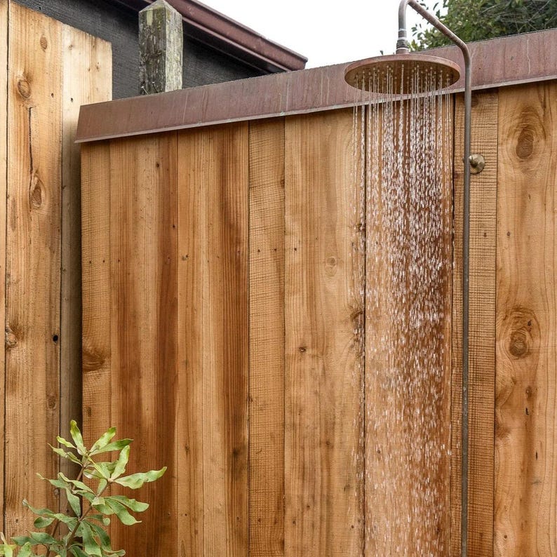Outdoor copper and brass shower with industrial design

