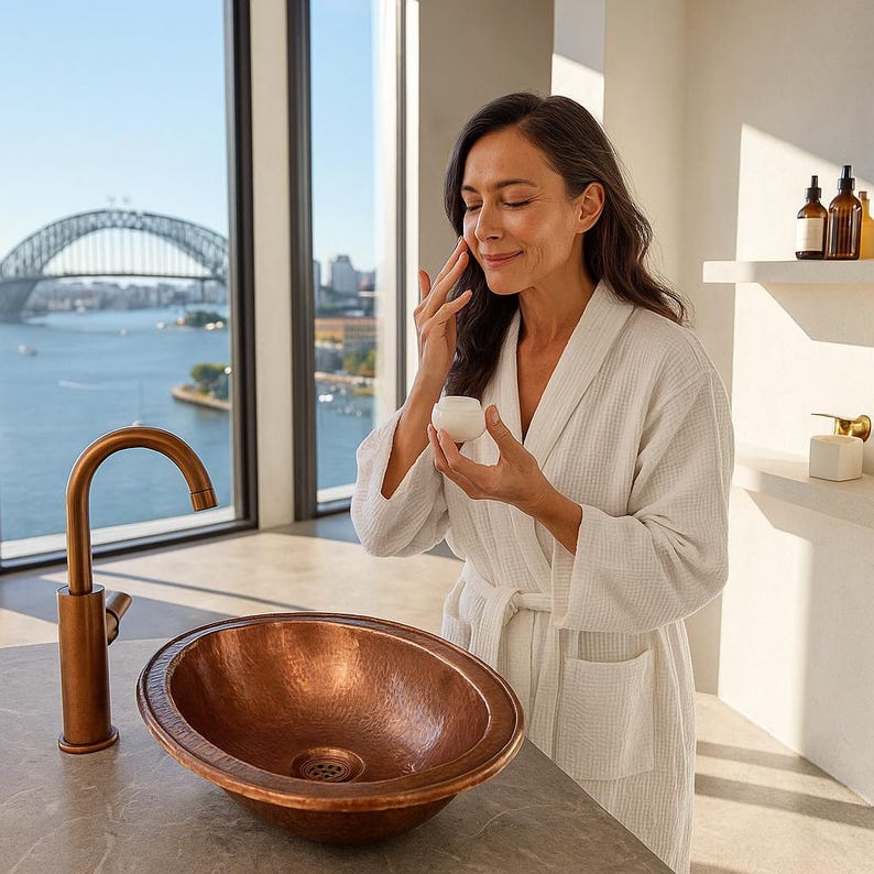 Oval hammered copper drop-in sink for farmhouse bathroom
