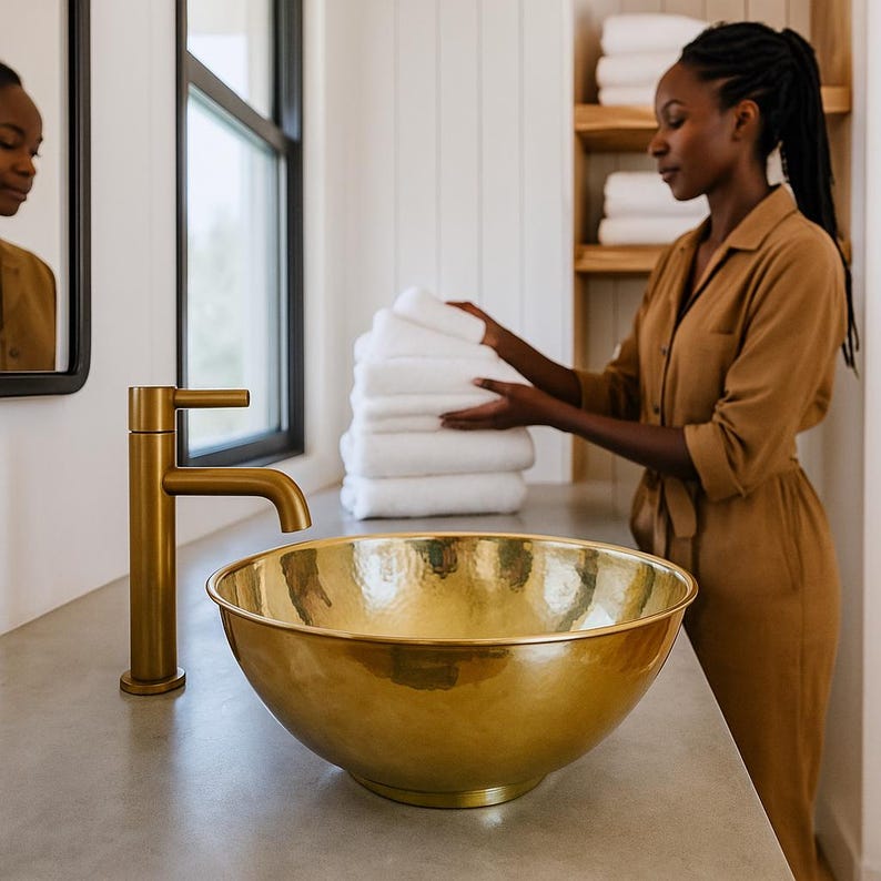 Round handmade brass bathroom basin with polished finish