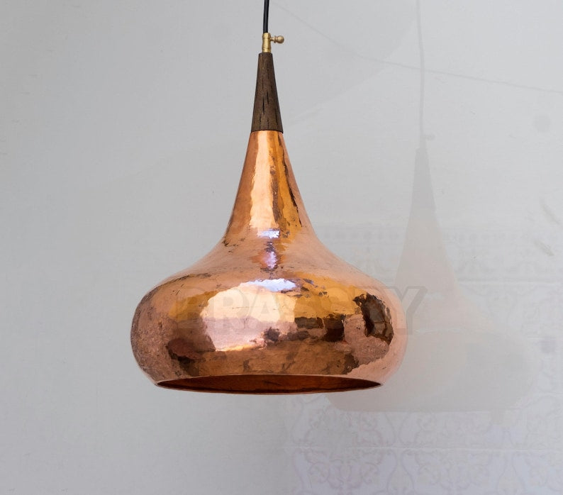 Hand-hammered copper pendant with glowing patina finish

