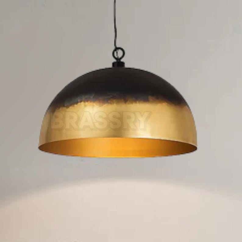 Rusted Moroccan copper dome pendant light over kitchen island

