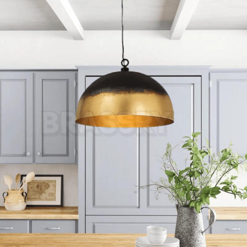 Rusted Moroccan copper dome pendant light over kitchen island

