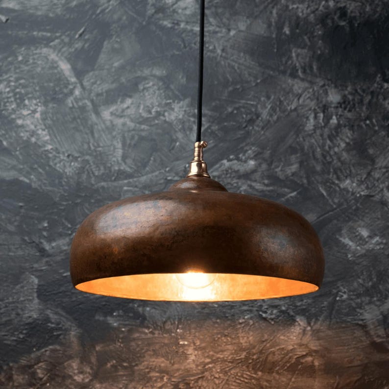Rustic Moroccan hammered copper dome pendant light with aged finish

