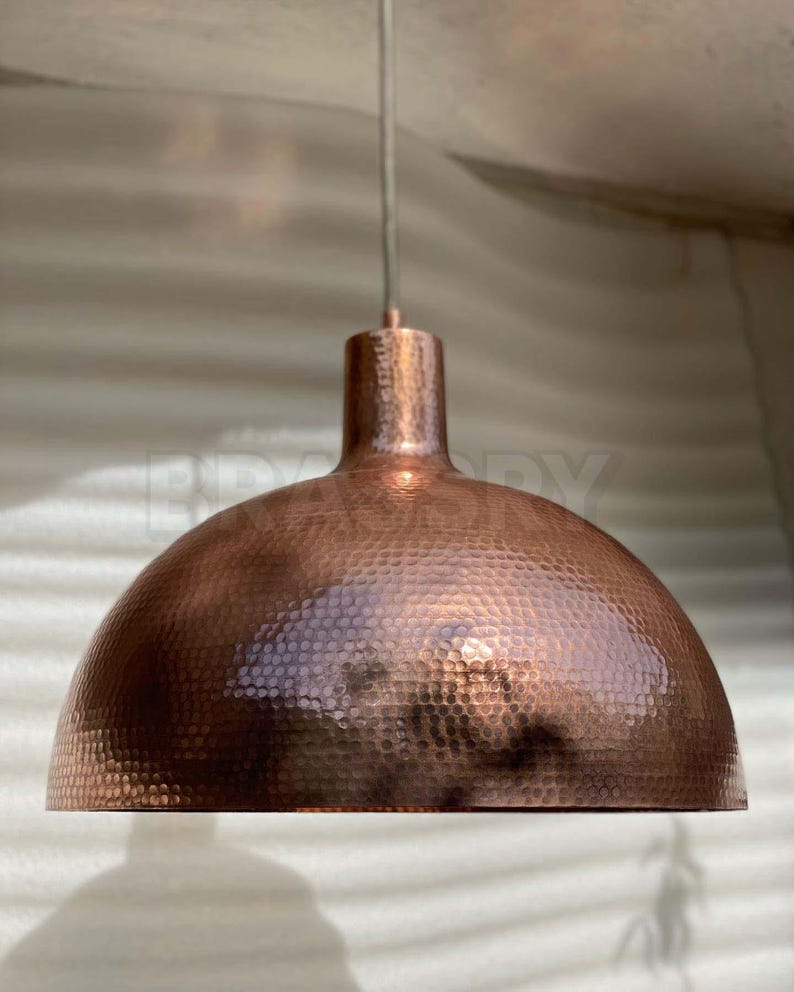 Rustic Moroccan hammered copper dome pendant light with aged finish

