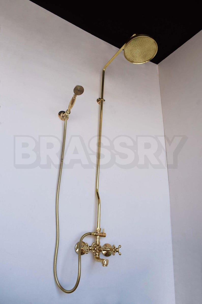 Rustic bathroom featuring unlacquered brass rainfall showerhead

