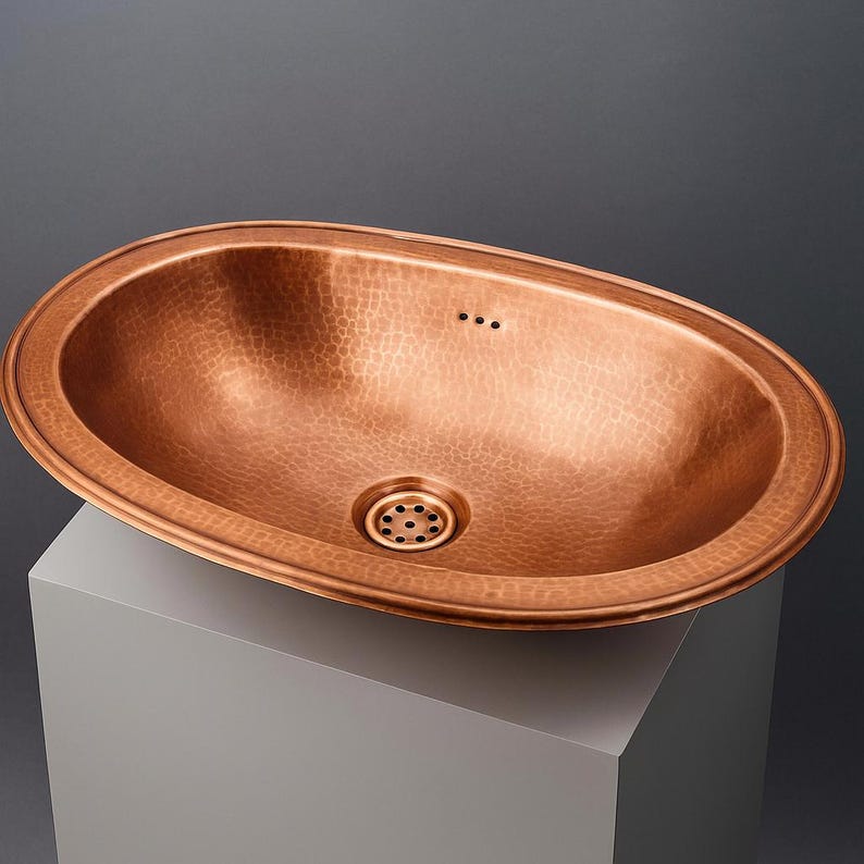 Oval hammered copper drop-in sink for farmhouse bathroom