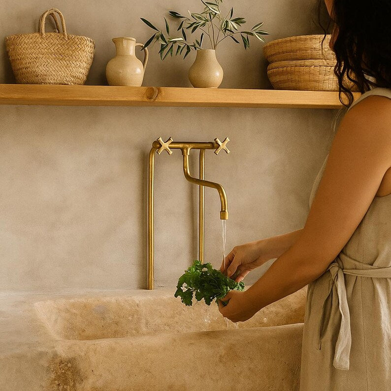 Tall solid brass bridge faucet with exposed pipe design

