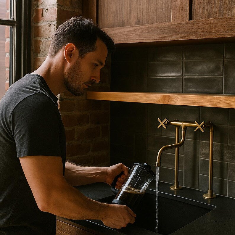 Tall solid brass bridge faucet with exposed pipe design

