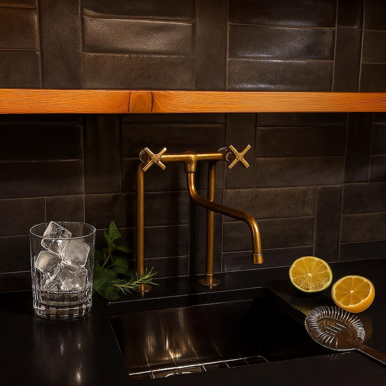 Tall solid brass bridge faucet with exposed pipe design

