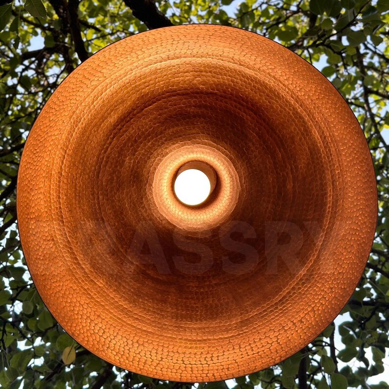 Handcrafted white and copper ceiling light over kitchen island