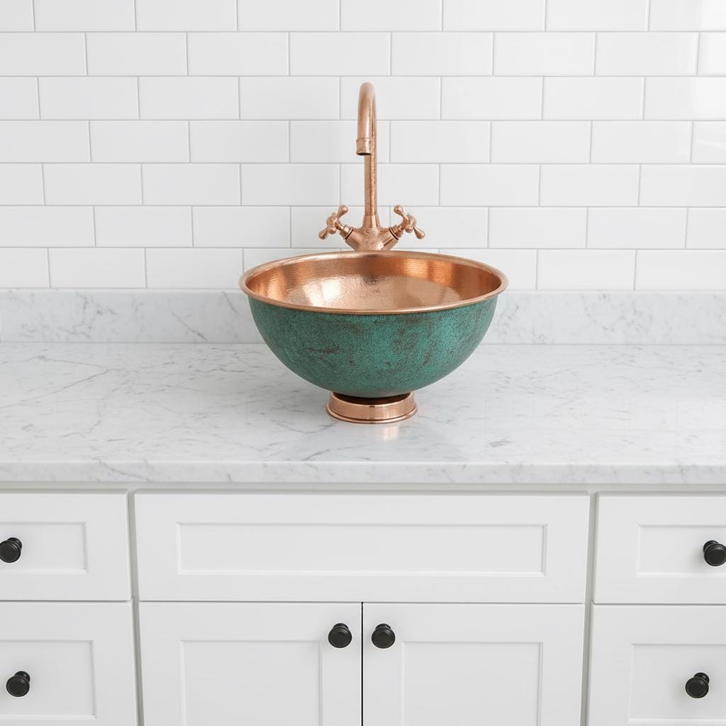 Copper sink with greenish-blue basin in a kitchen setting