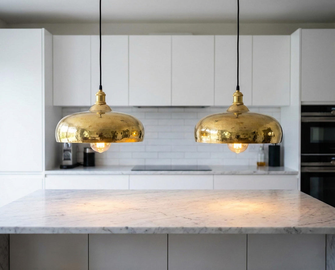 Modern kitchen with gold pendant lights and marble countertop