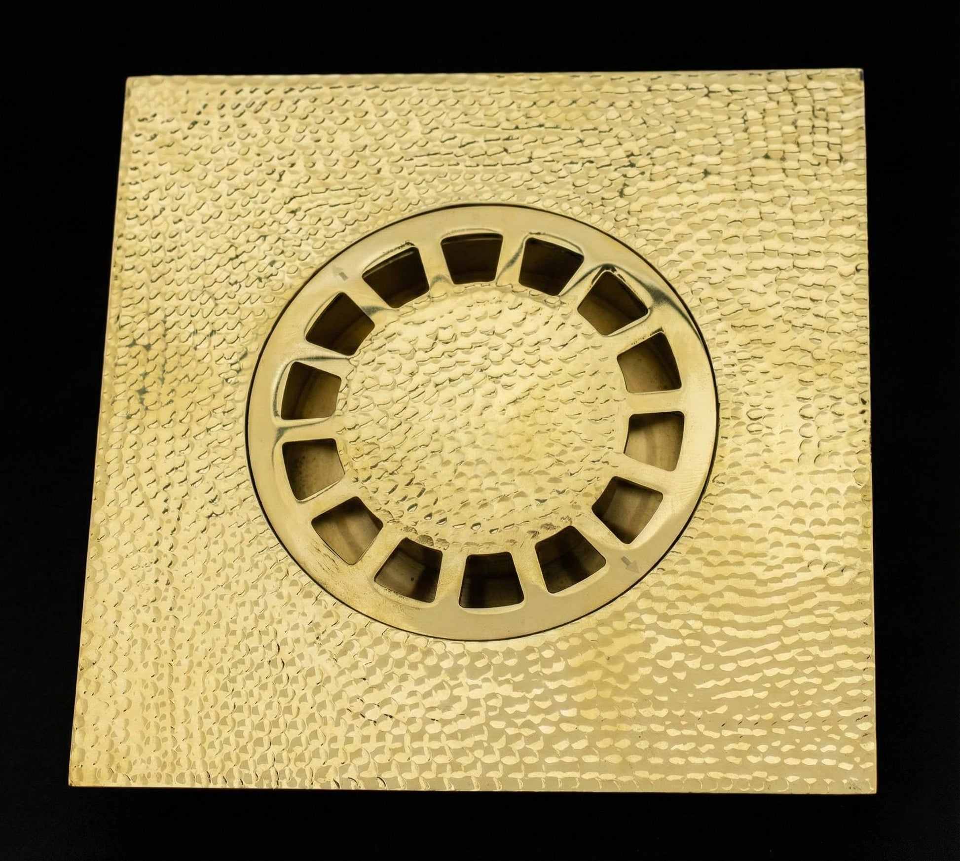 Square brass drain cover with circular center 