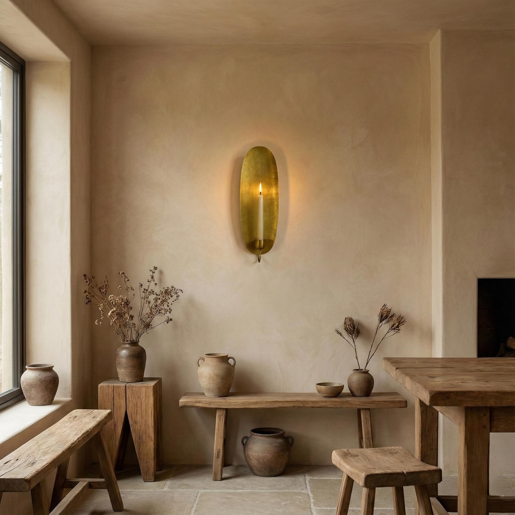 Nestled corner of a room with wooden furniture, wall sconce, and decorative elements.
