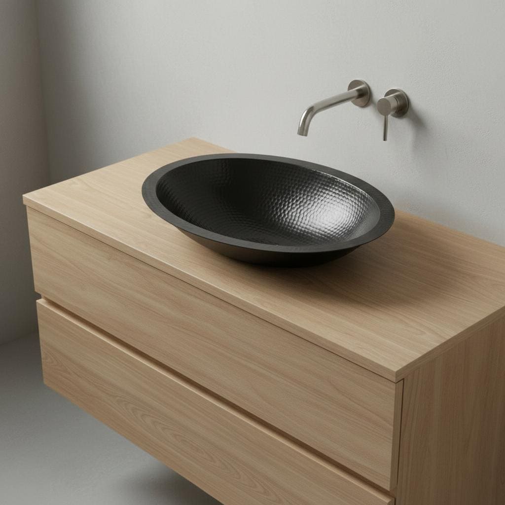 Bathroom vanity with a black sink and wooden cabinet.