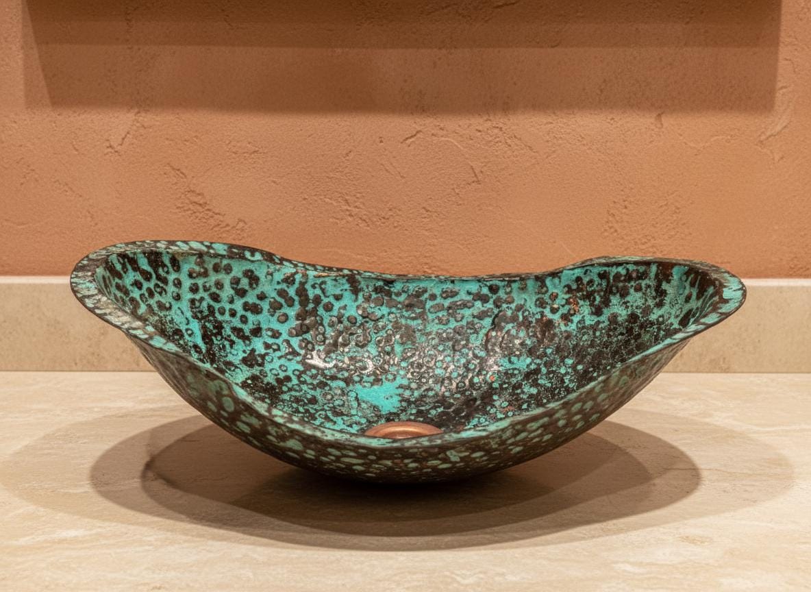 Decorative ceramic bowl with a speckled green and brown design on a beige surface.