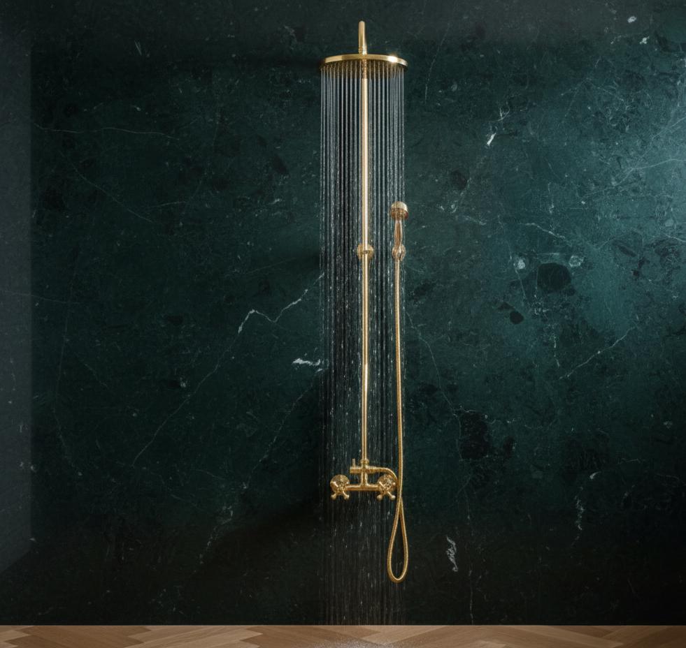 Gold shower head and hose against a dark green marble wall
