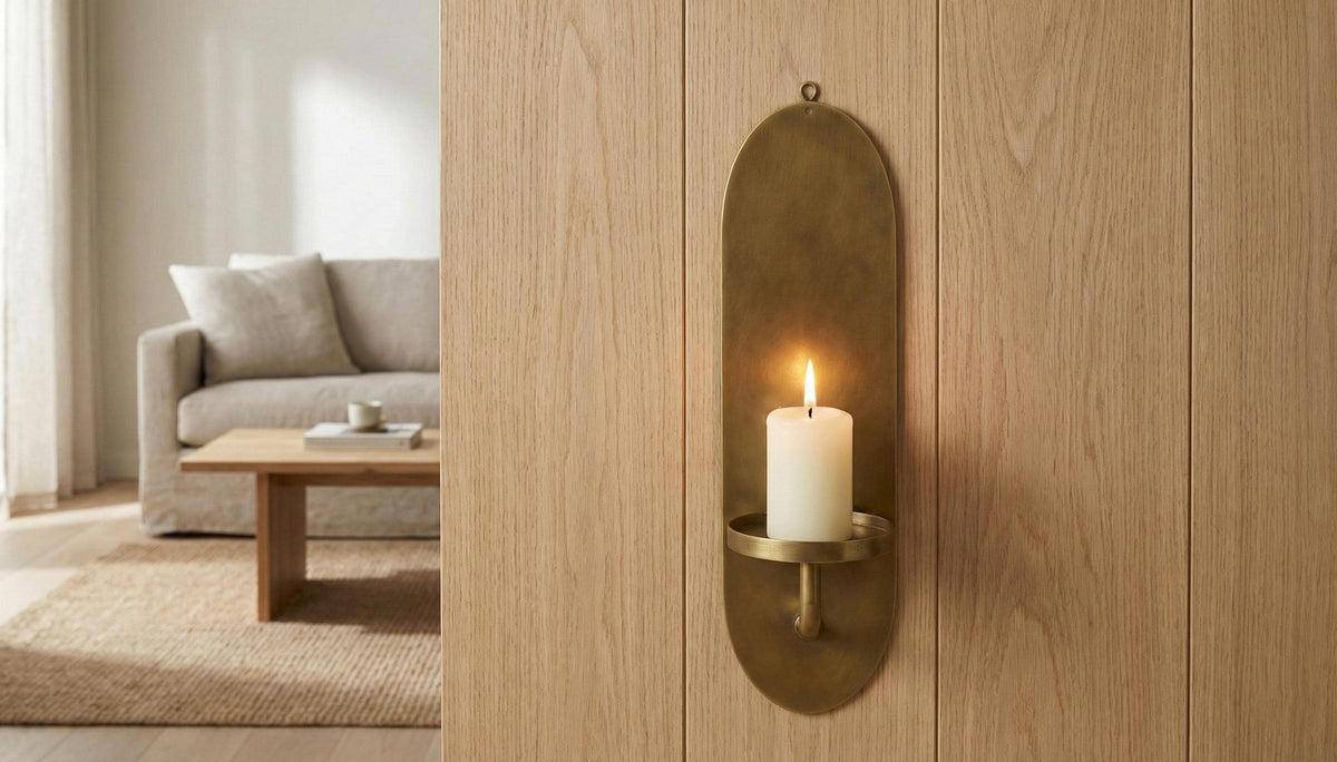 Decorative wall sconce with a candle on a wooden wall in a living room setting.