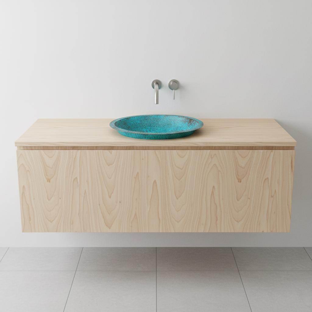 Bathroom vanity with a turquoise sink on a white background