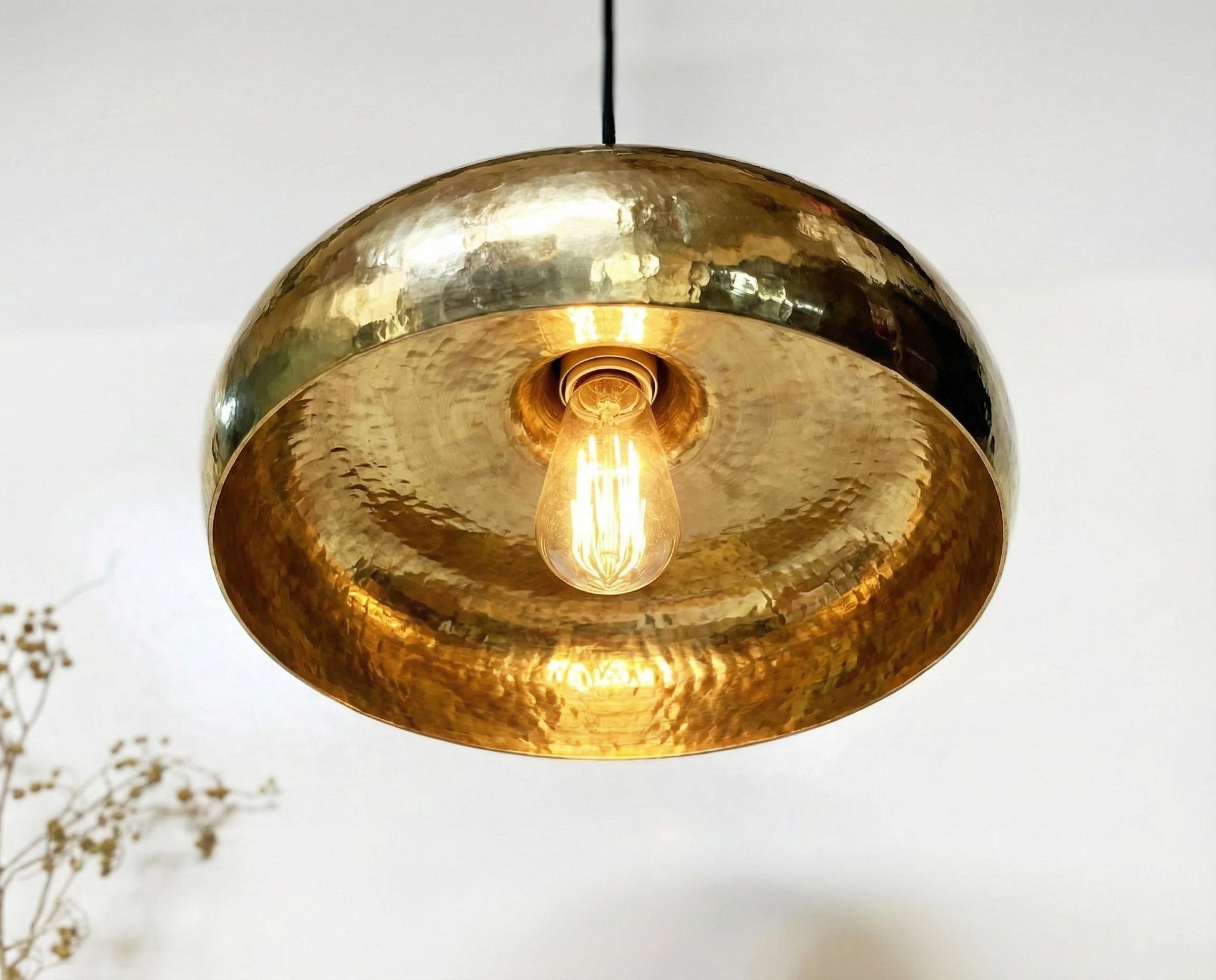 Gold pendant light with a blurred background