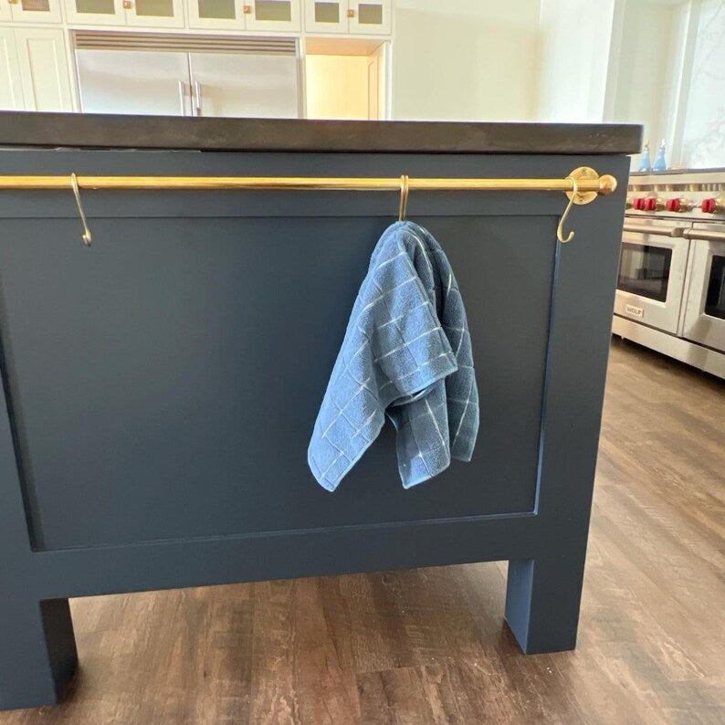 Rustic farmhouse kitchen with Moroccan brass wall-mounted rail rack and hooks

